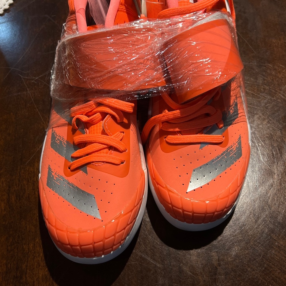 Adidas Women Javelin Orange and Silver Athletic Shoes with Reflective Accents